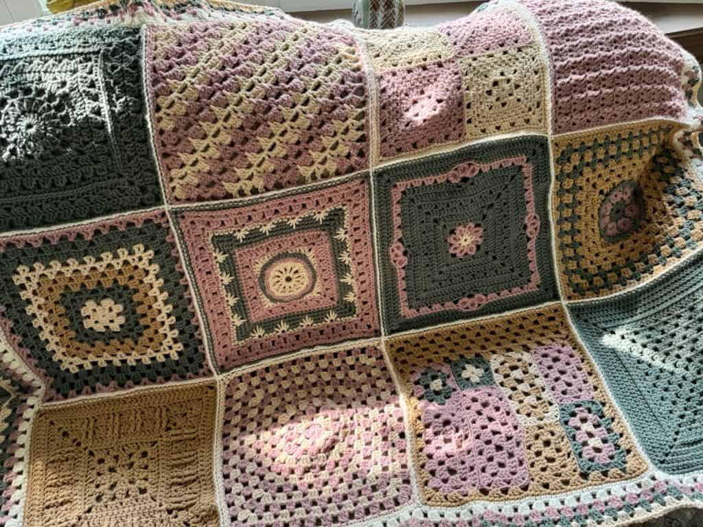 A photo of the 2024 granny stitch sampler blanket for the free crochet along