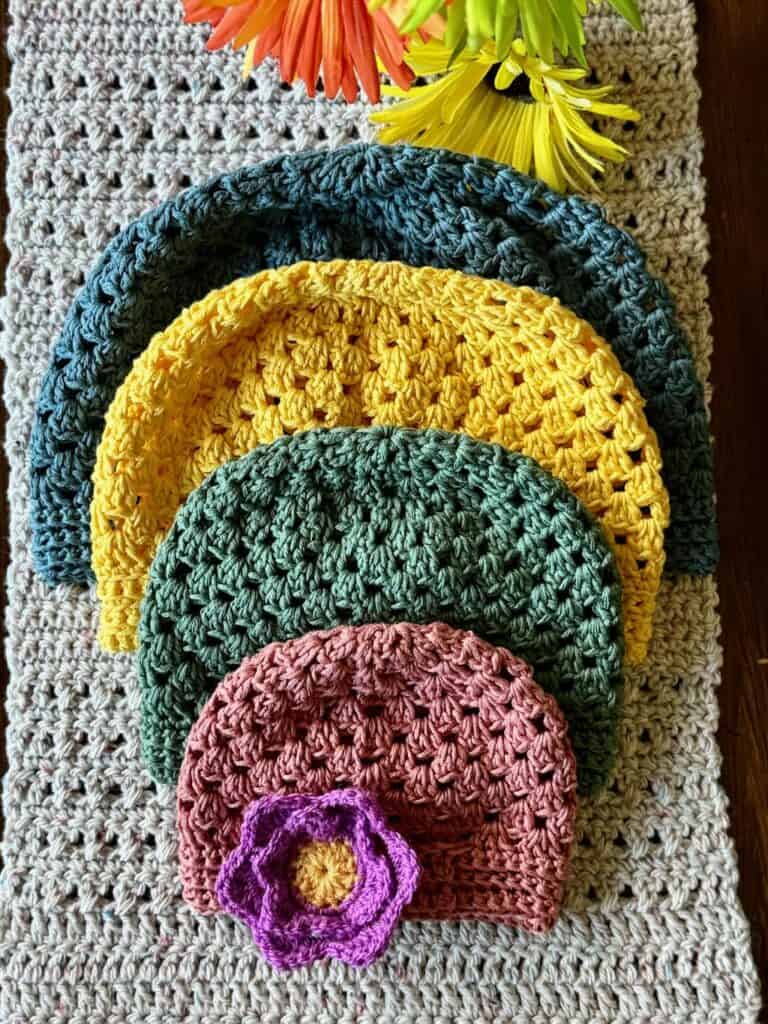 A photo of 4 different granny stitch hats