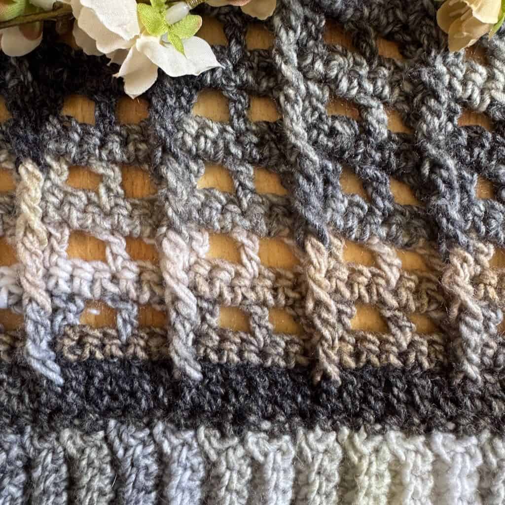 A closeup photo of the Columns and Arches stitch pattern in the Sofia Wrap granny stitch shawl